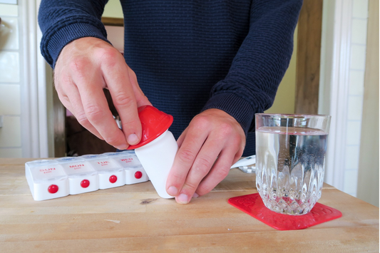 Image of individual opening medication bottle will a bottle opener