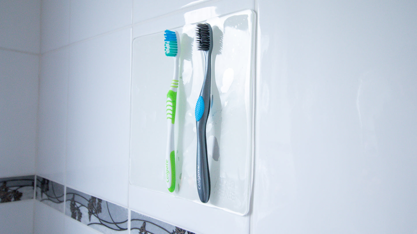 extreme mat in bathroom on wall with 2 toothbrushes