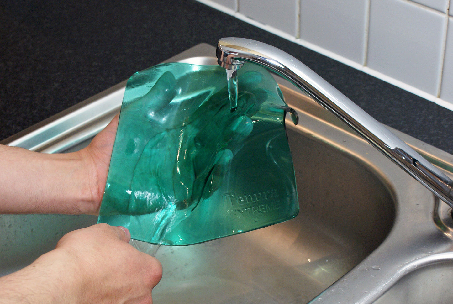 extreme mat being washed in the sink